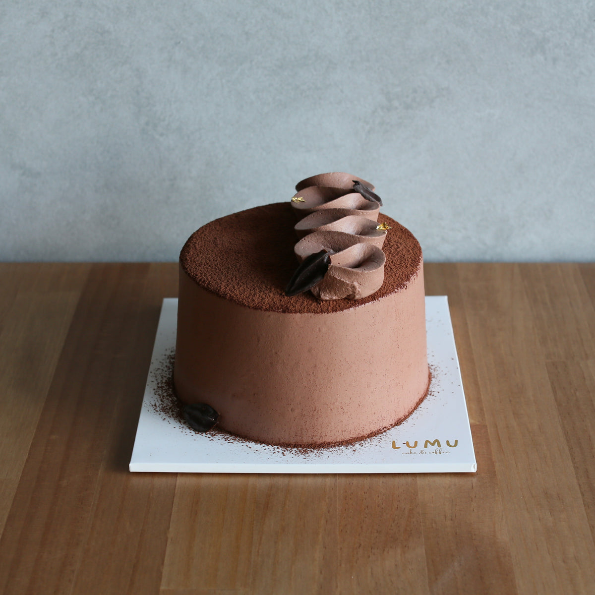 Classic chocolate chiffon cake with chocolate cream and chocolate pearls
